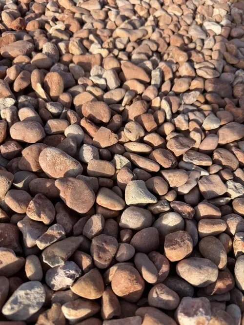 3/4 inch White Pink Cobble landscape rock, close up